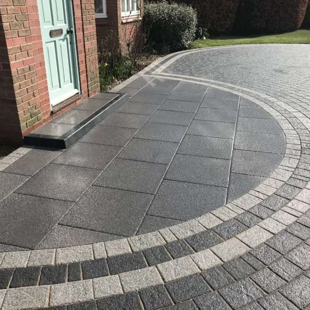 Circular block paved feature in a driveway