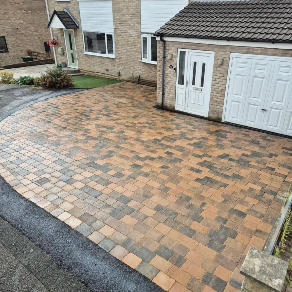 Brindle block paved driveway after rain