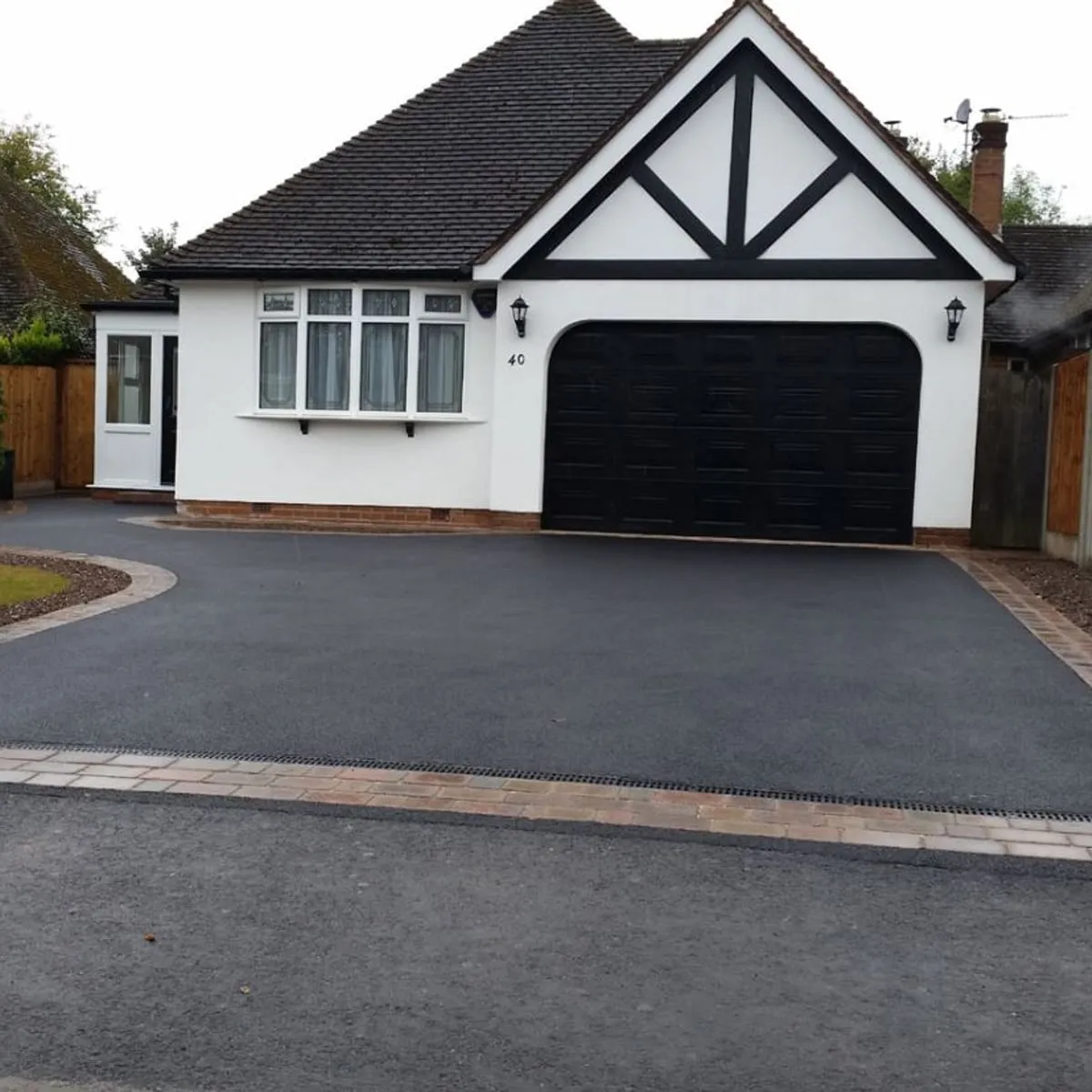 New tarmac driveway at a white rendered house