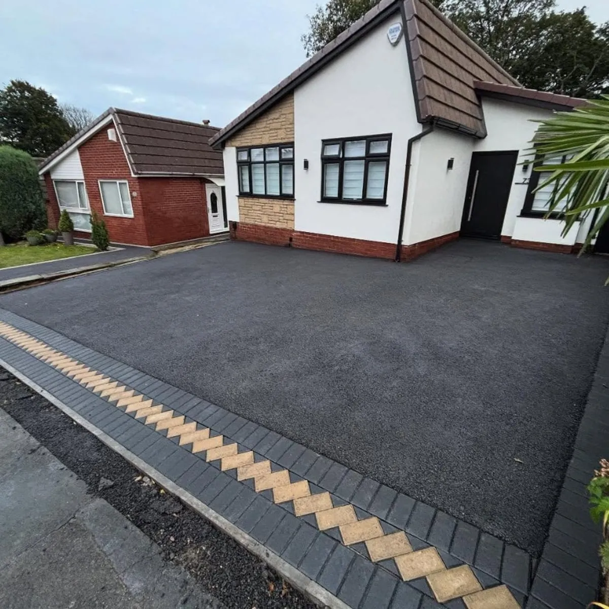 Tarmac driveway with a decorative block border