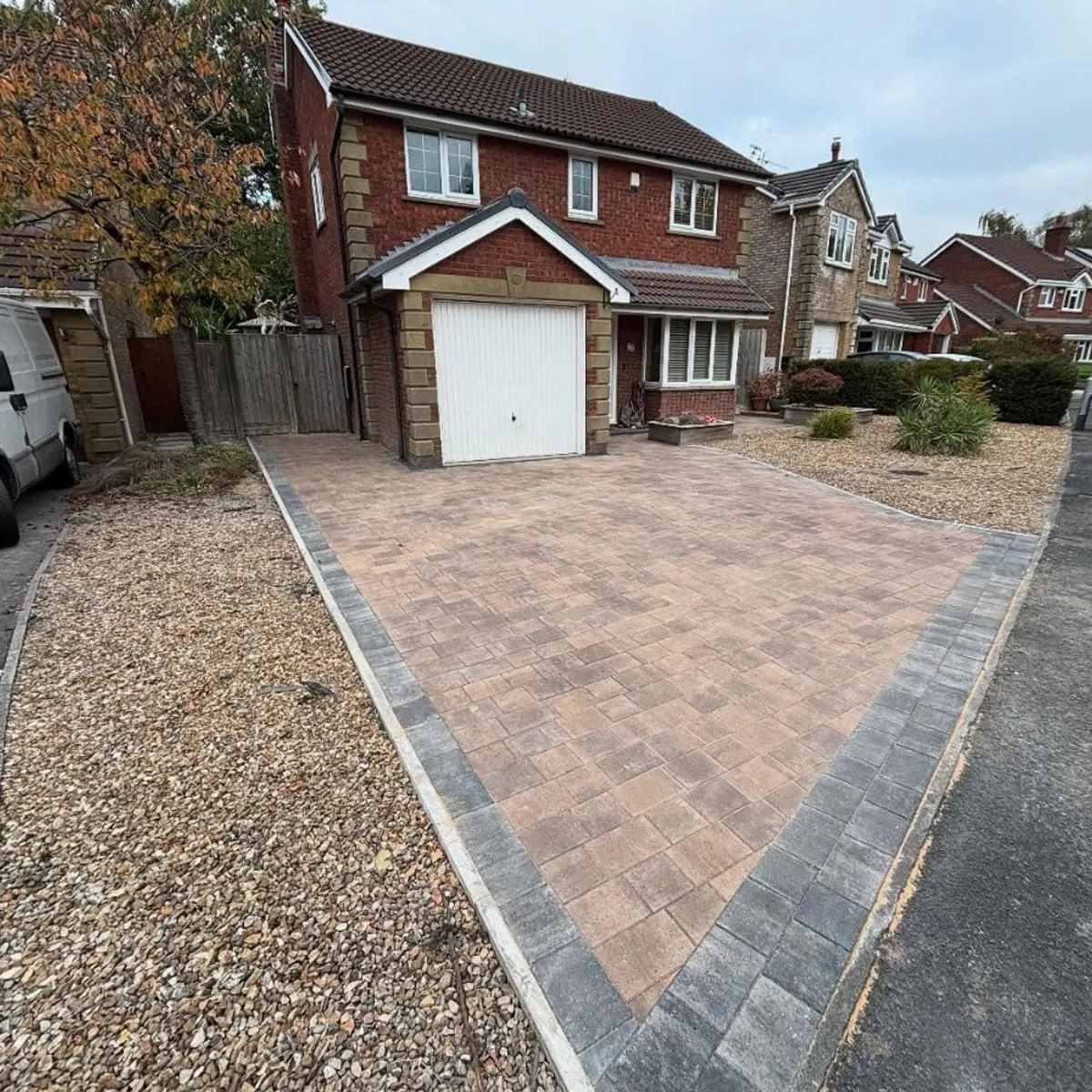 Gravel driveway with a block paved centre strip