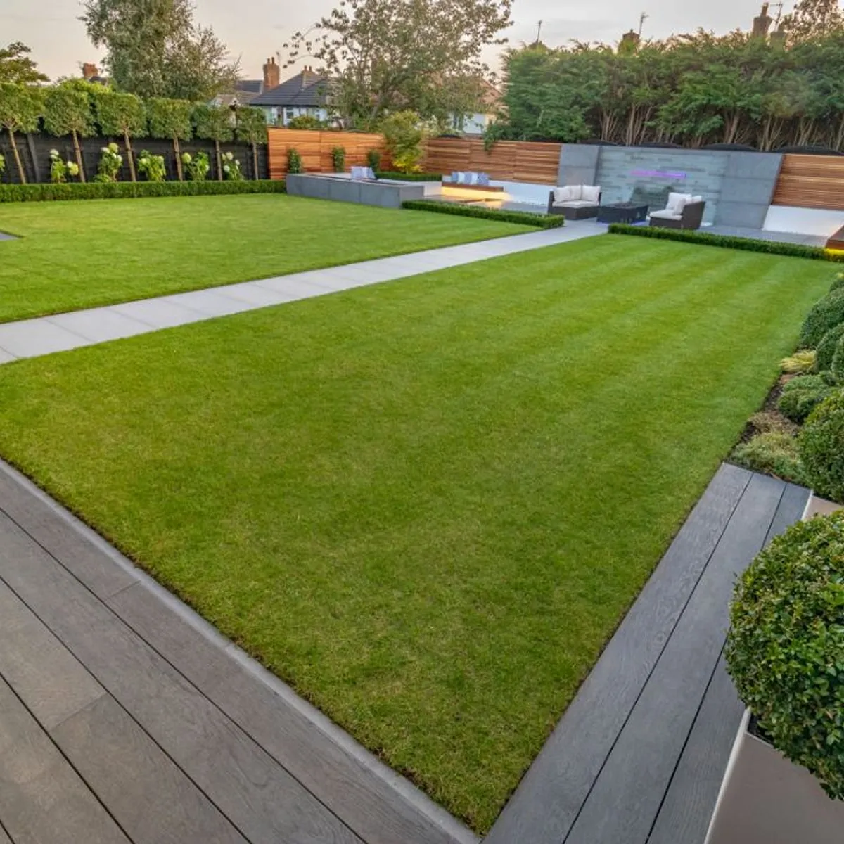 Landscaped garden with a lawn and clipped hedging
