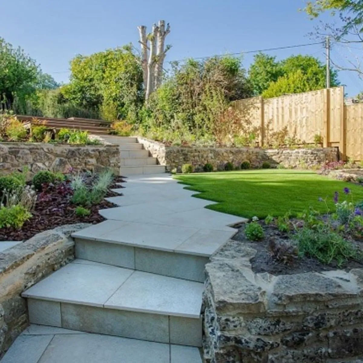 Stone steps and a garden path through planting