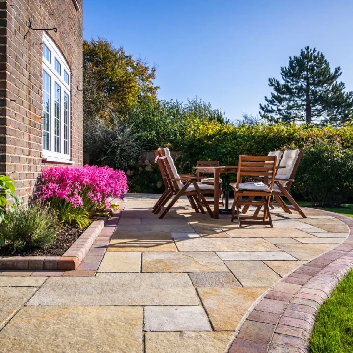 Indian sandstone patio with garden furniture