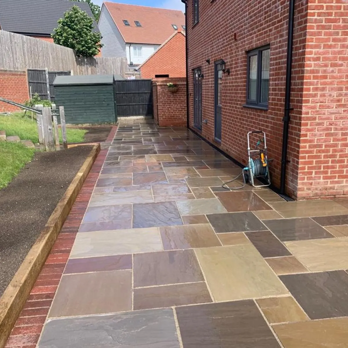 Riven indian sandstone patio and brick path