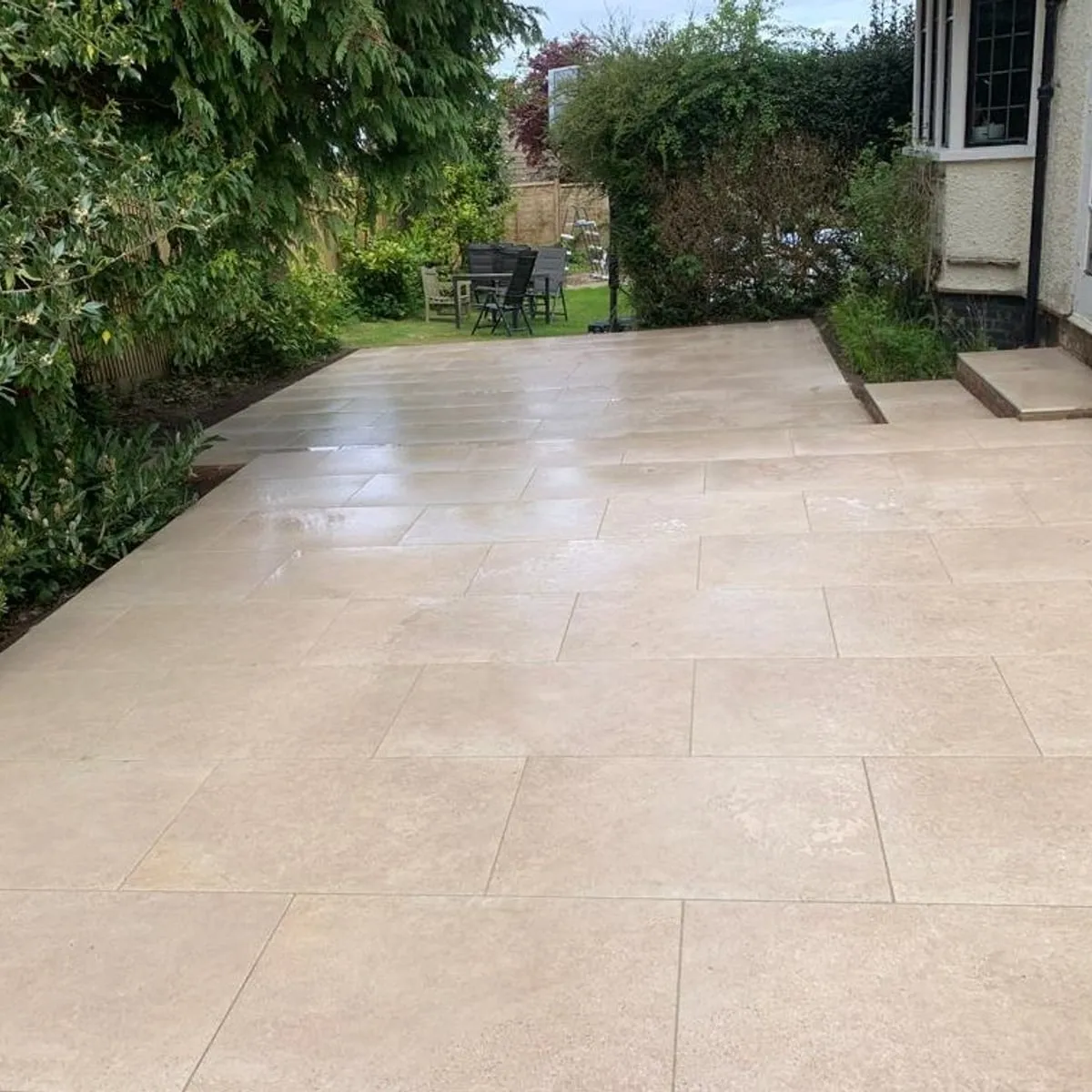 Porcelain patio and steps to a garden room