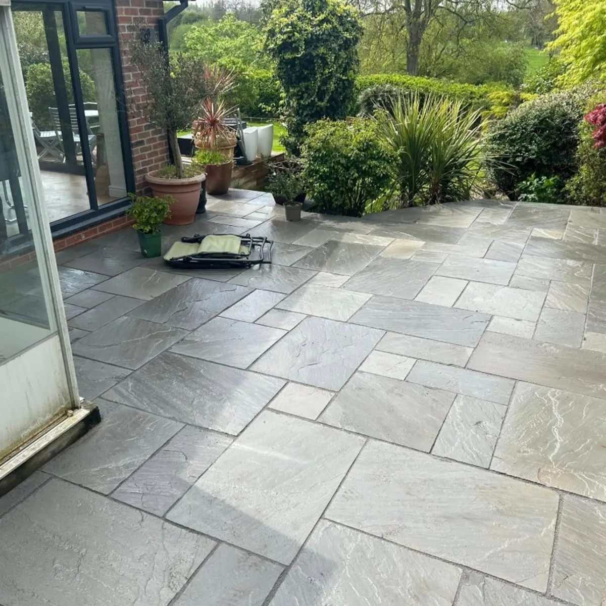 Stone patio outside a conservatory