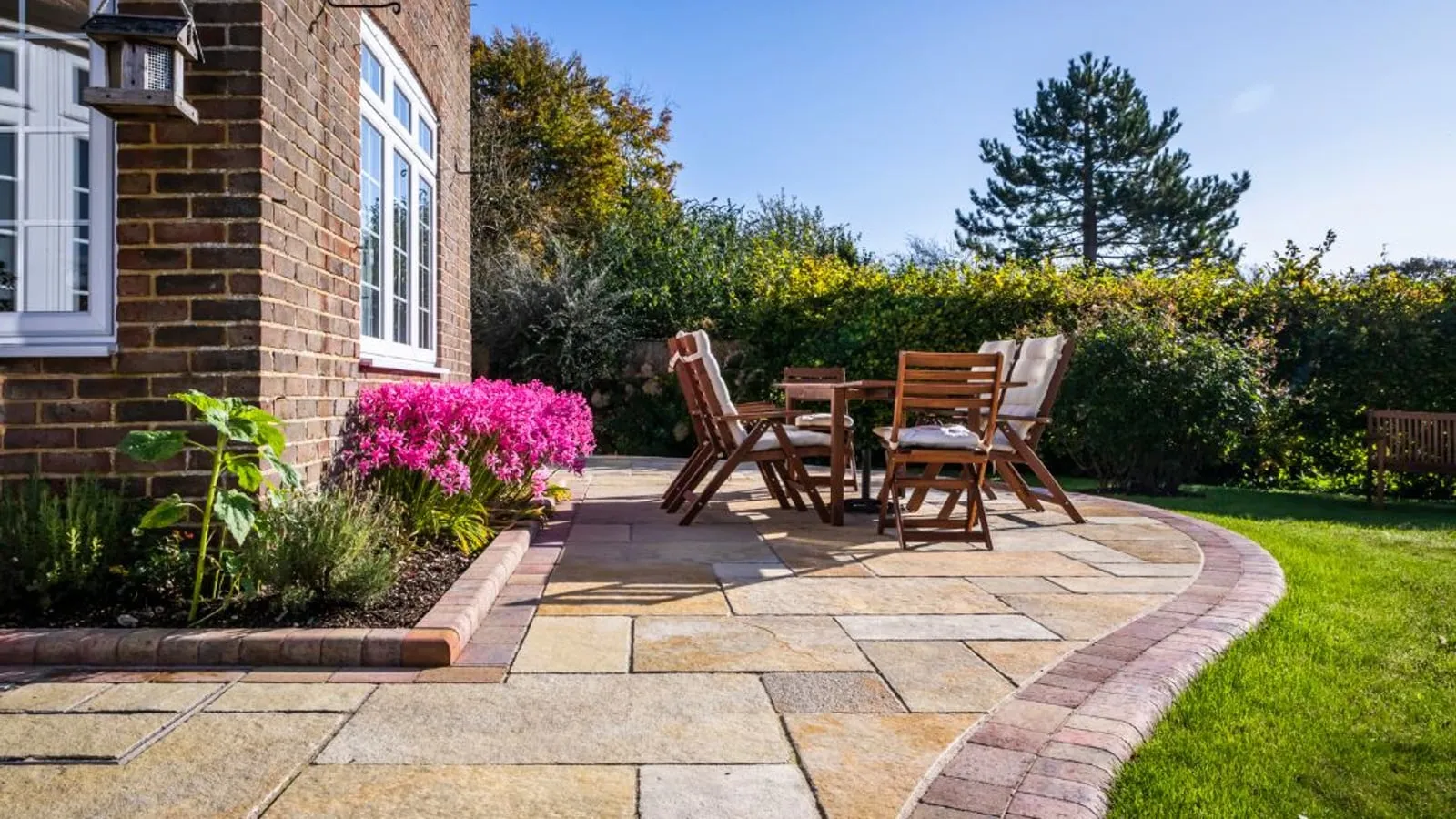 Indian sandstone patio with garden furniture