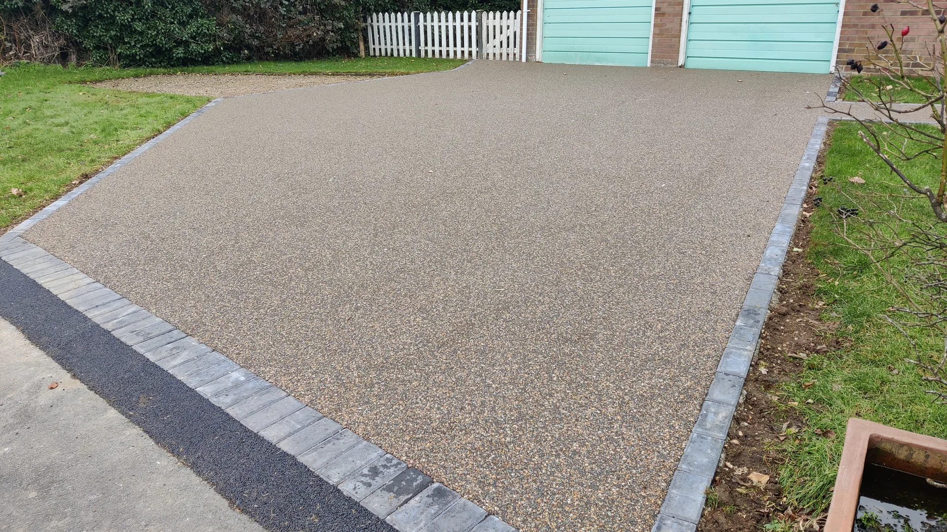 Resin bound driveway at a modern brick house